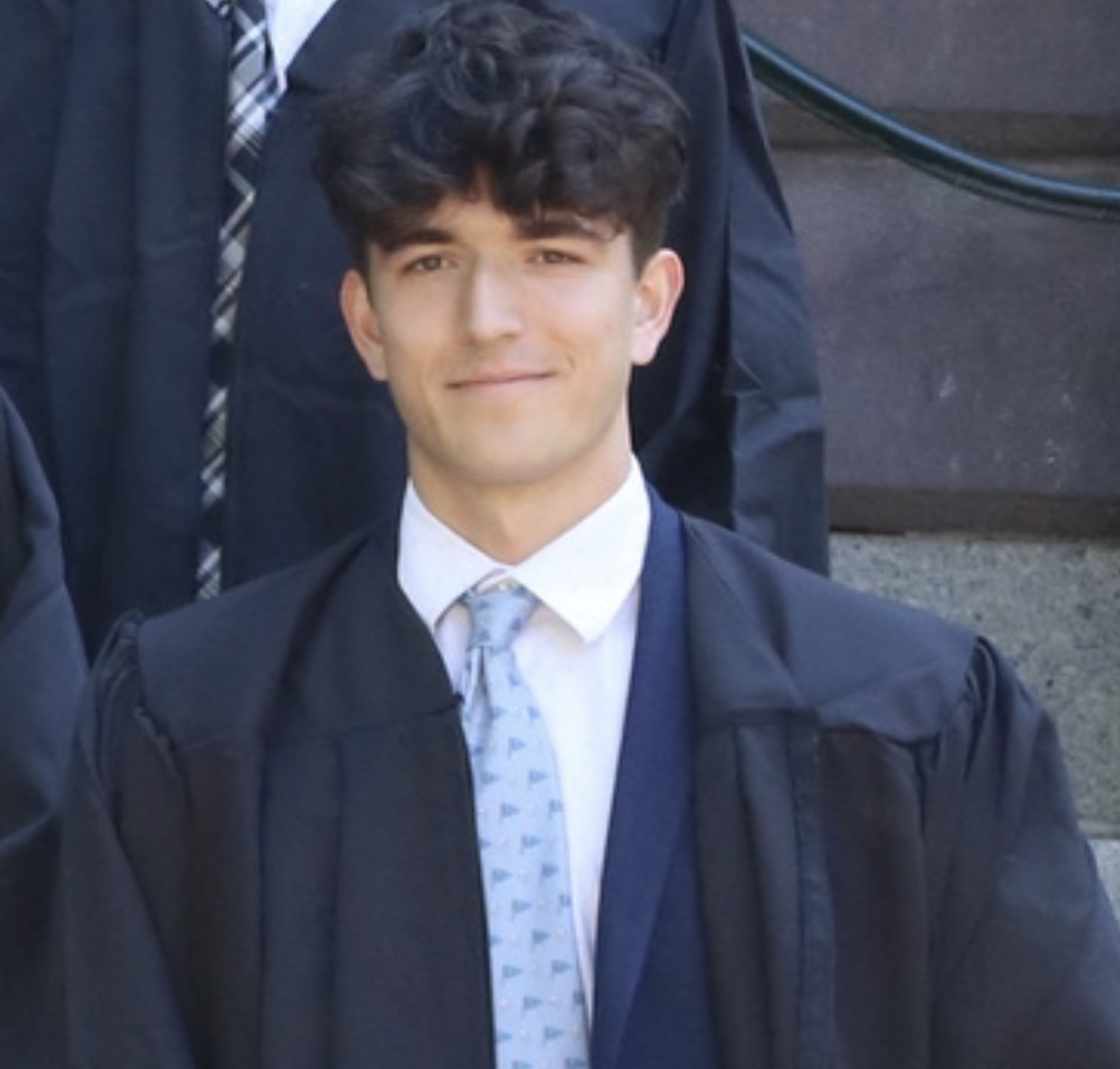 Eric Muthersbaugh in graduation attire.